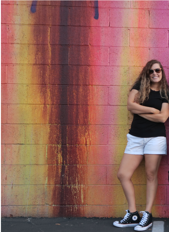 photo of developer in front of graffiti wall